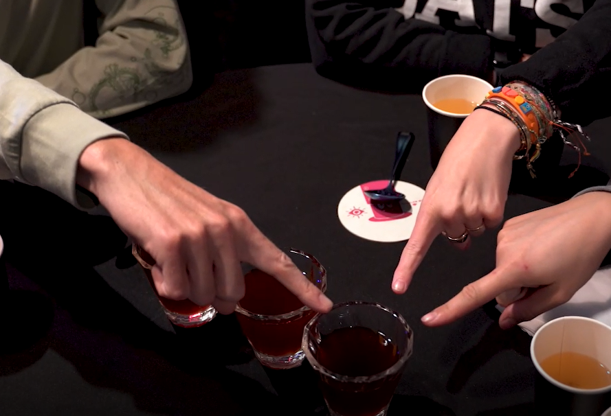 Crowd pointing at coffee